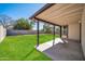 Covered patio overlooking a grassy backyard at 14821 N 60Th Dr, Glendale, AZ 85306