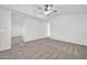 Bright bedroom featuring neutral carpet and ceiling fan at 14821 N 60Th Dr, Glendale, AZ 85306