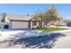 House exterior featuring a tree and a neat front yard at 14821 N 60Th Dr, Glendale, AZ 85306