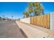 Residential street view with a wood gate and block wall at 14821 N 60Th Dr, Glendale, AZ 85306