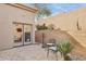 Private backyard patio with seating area and desert landscaping at 15548 E Jojoba Ln, Fountain Hills, AZ 85268