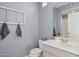 Simple bathroom with sink, toilet and decorative wall hanging at 15548 E Jojoba Ln, Fountain Hills, AZ 85268