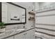 Bathroom with granite countertop, white cabinets, and a striped shower curtain at 15548 E Jojoba Ln, Fountain Hills, AZ 85268