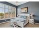 Bright bedroom with a white bed frame and large window at 15548 E Jojoba Ln, Fountain Hills, AZ 85268