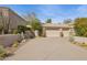 Two-car garage and nicely landscaped front yard at 15548 E Jojoba Ln, Fountain Hills, AZ 85268