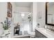 Bathroom features a walk-in shower and a modern vanity with marble countertop at 16224 W La Ventilla Way, Goodyear, AZ 85338