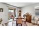 Bright dining area with a round table and four chairs, near sliding glass doors to the patio at 16224 W La Ventilla Way, Goodyear, AZ 85338