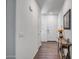 Bright entryway with wood-look floors and a console table at 16224 W La Ventilla Way, Goodyear, AZ 85338