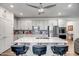 Modern kitchen with white cabinets and a large island at 16224 W La Ventilla Way, Goodyear, AZ 85338