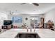 Kitchen features a large island with a sink, and views into the living and dining areas at 16224 W La Ventilla Way, Goodyear, AZ 85338