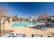 Community swimming pool with plenty of seating at 16224 W La Ventilla Way, Goodyear, AZ 85338