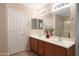 Double vanity bathroom with a large mirror and a separate shower at 16225 N 22Nd Dr, Phoenix, AZ 85023