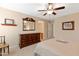 Charming bedroom with large dresser and ceiling fan at 16225 N 22Nd Dr, Phoenix, AZ 85023