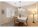 Dining area with wood table and chairs, and window lighting at 16225 N 22Nd Dr, Phoenix, AZ 85023