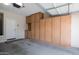 Garage with built-in storage cabinets and overhead door at 16225 N 22Nd Dr, Phoenix, AZ 85023