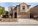 Two-story house with a beige facade and two-car garage at 16225 N 22Nd Dr, Phoenix, AZ 85023