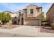 Two-story house with a beige facade and two-car garage at 16225 N 22Nd Dr, Phoenix, AZ 85023