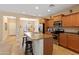 Kitchen with island, stainless steel appliances, and wood cabinets at 16225 N 22Nd Dr, Phoenix, AZ 85023