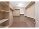 Spacious walk-in closet with ample shelving and hanging space at 16225 N 22Nd Dr, Phoenix, AZ 85023