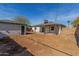 Backyard view showcasing a single-story home with a covered patio area at 1743 W Verde Ln, Phoenix, AZ 85015