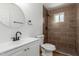 Clean bathroom with brown tile shower and white vanity at 1743 W Verde Ln, Phoenix, AZ 85015