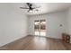 Bright bedroom with light wood flooring and sliding door access to backyard at 1743 W Verde Ln, Phoenix, AZ 85015