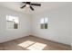 Bright bedroom with new flooring and ceiling fan at 1743 W Verde Ln, Phoenix, AZ 85015