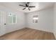 Well-lit bedroom with wood floors and ceiling fan at 1743 W Verde Ln, Phoenix, AZ 85015