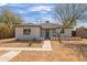 Remodeled single story home with desert landscaping and walkway at 1743 W Verde Ln, Phoenix, AZ 85015