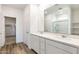 Main bathroom with double vanity and marble countertop at 17826 W Sanna St, Waddell, AZ 85355