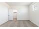 Simple bedroom with gray carpet and a walk-in closet at 17826 W Sanna St, Waddell, AZ 85355