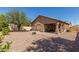 Backyard features a patio, fire pit, and gravel landscaping at 1825 N Lewis Pl, Casa Grande, AZ 85122