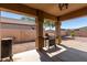 Covered patio with built-in grill, perfect for outdoor entertaining at 1825 N Lewis Pl, Casa Grande, AZ 85122