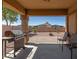 Covered patio with built-in grill and desert landscape at 1825 N Lewis Pl, Casa Grande, AZ 85122