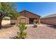 Spacious backyard with patio, fire pit, and gravel landscaping at 1825 N Lewis Pl, Casa Grande, AZ 85122