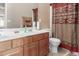 Bathroom with double vanity and southwestern style shower curtain at 1825 N Lewis Pl, Casa Grande, AZ 85122