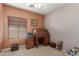 Cozy bedroom with home office and window seating at 1825 N Lewis Pl, Casa Grande, AZ 85122