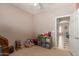 Playroom with built-in shelving and access to hallway at 1825 N Lewis Pl, Casa Grande, AZ 85122