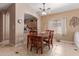 Cozy dining area with a wooden table set for four at 1825 N Lewis Pl, Casa Grande, AZ 85122