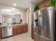 Kitchen boasts stainless steel appliances and wood cabinets at 1825 N Lewis Pl, Casa Grande, AZ 85122