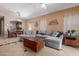 Spacious living room featuring a sectional sofa and tile floors at 1825 N Lewis Pl, Casa Grande, AZ 85122