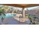 Backyard with pool, patio furniture, and putting green at 18489 N Davis Dr, Maricopa, AZ 85138