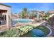 Backyard oasis with inviting pool and patio furniture at 18489 N Davis Dr, Maricopa, AZ 85138