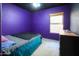 Purple bedroom with double bed and dresser at 18489 N Davis Dr, Maricopa, AZ 85138