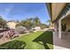 Artificial turf backyard with desert landscaping at 18606 N Iona Ct, Sun City West, AZ 85375