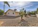 Backyard view of home with gravel and rock landscaping at 18606 N Iona Ct, Sun City West, AZ 85375