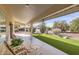 Covered patio overlooking a spacious backyard with artificial turf at 18606 N Iona Ct, Sun City West, AZ 85375