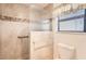 Bathroom with walk-in shower and grab bars at 18606 N Iona Ct, Sun City West, AZ 85375