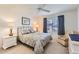 Guest bedroom with ceiling fan and ample closet space at 18606 N Iona Ct, Sun City West, AZ 85375