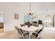 Dining area with a four-person table set and view into the living room at 18606 N Iona Ct, Sun City West, AZ 85375